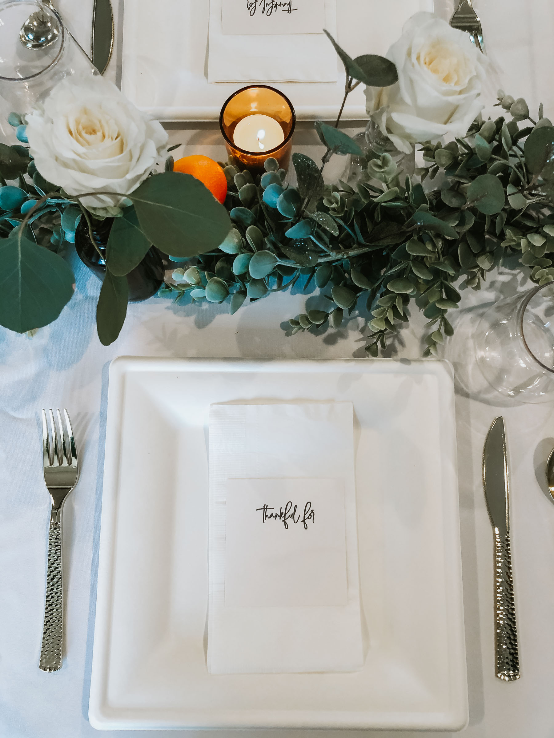 Eucalyptus and orange Thanksgiving tablescape | Nicole Victory Design