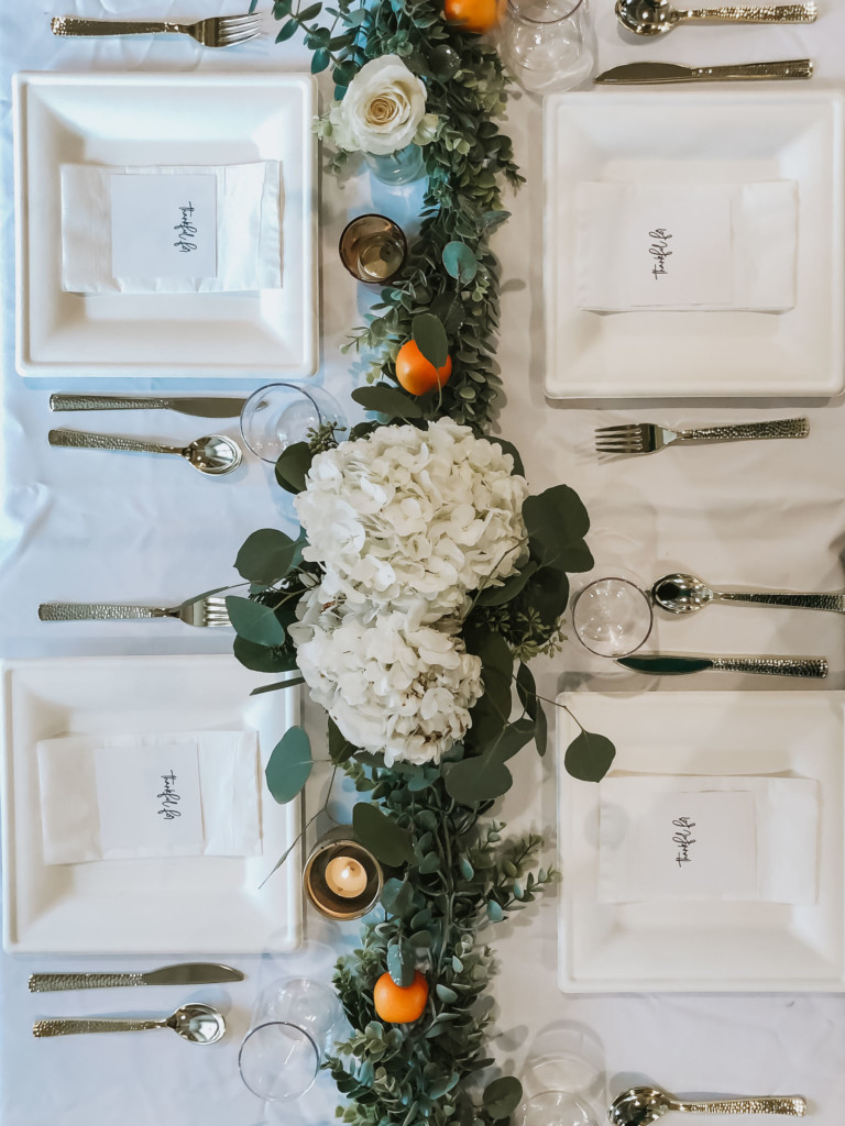 Eucalyptus and orange Thanksgiving tablescape with gratitude card | Nicole Victory Design