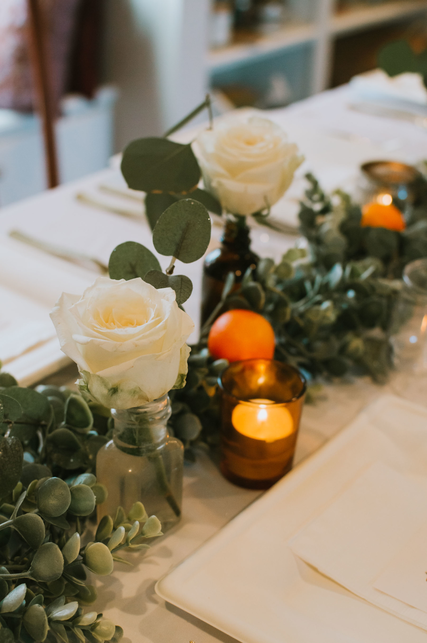 Eucalyptus and orange Thanksgiving tablescape | Nicole Victory Design