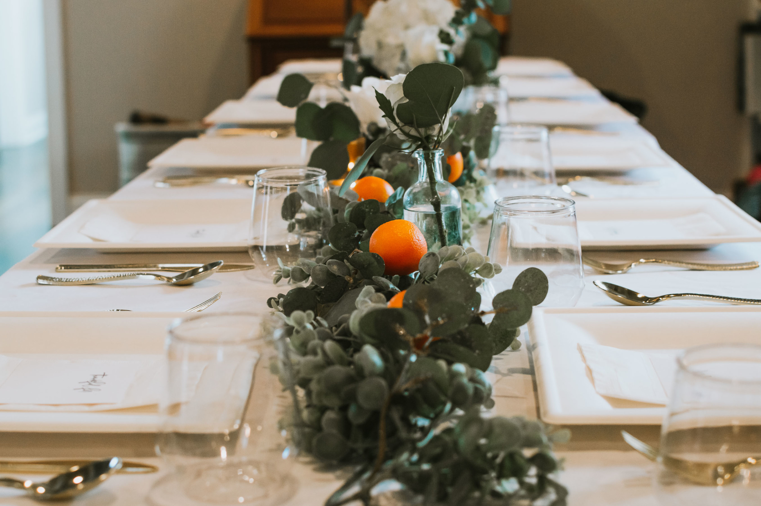 Eucalyptus and orange Thanksgiving tablescape | Nicole Victory Design